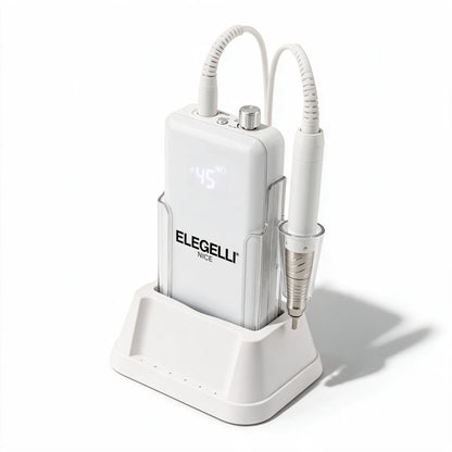 Elegelli Nice cordless nail drill from a three-quarter angle: white control unit, charging base and brushless handpiece